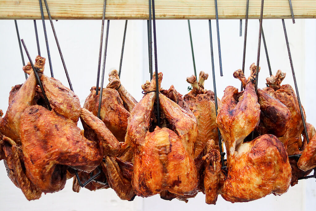 Fried turkeys hang on hooks